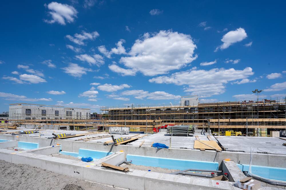 Construction site with scaffolding under a clear sky